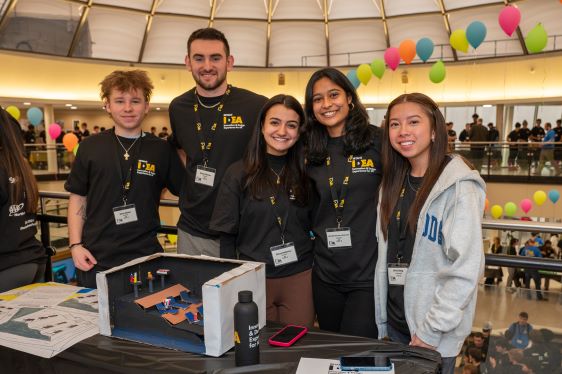 Bryant students pose with their prototype during the IDEA program.