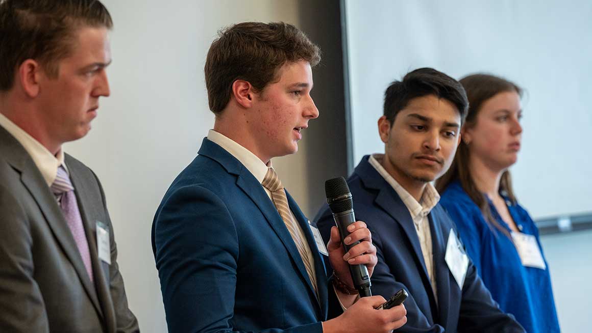 A group of Bryant University students make a presentation during the school's Financial Services Forum.