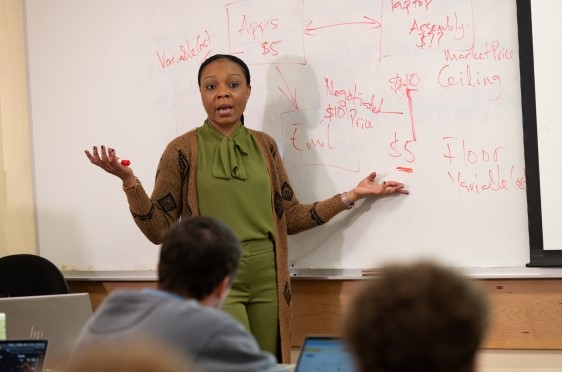 Bryant Assistant Professor of Accounting Muni Kelly teaching in a classroom