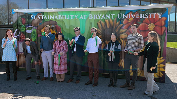 Ribbon cutting for new composter at Bryant University